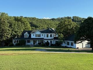134 Meadowbrook Ln, Walnut Shade, MO 65771 - view of front of home with a front lawn and a view of trees