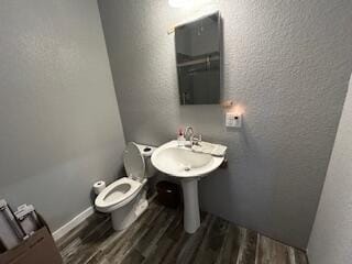 134 Meadowbrook Ln, Walnut Shade, MO 65771 - half bathroom with wood finished floors and a textured wall