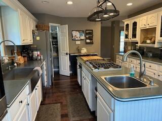 134 Meadowbrook Ln, Walnut Shade, MO 65771 - kitchen with white cabinets, stainless steel gas stovetop, recessed lighting, dark wood-style flooring, and glass insert cabinets