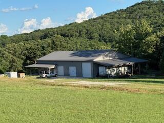 134 Meadowbrook Ln, Walnut Shade, MO 65771 - view of outbuilding featuring a forest view