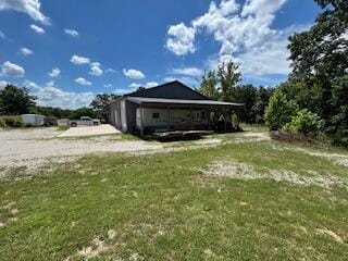 134 Meadowbrook Ln, Walnut Shade, MO 65771 - view of side of home with a lawn