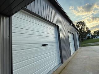 134 Meadowbrook Ln, Walnut Shade, MO 65771 - garage at dusk featuring a detached garage