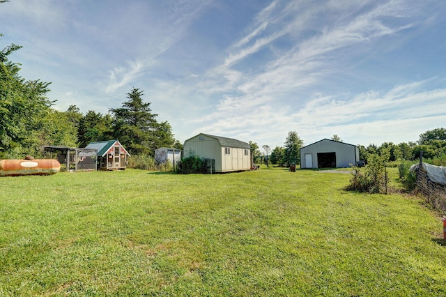 8404 Fossilsaurus Ln, Ash Grove, MO 65604 - view of grassy yard with an outbuilding, a detached garage, and exterior structure