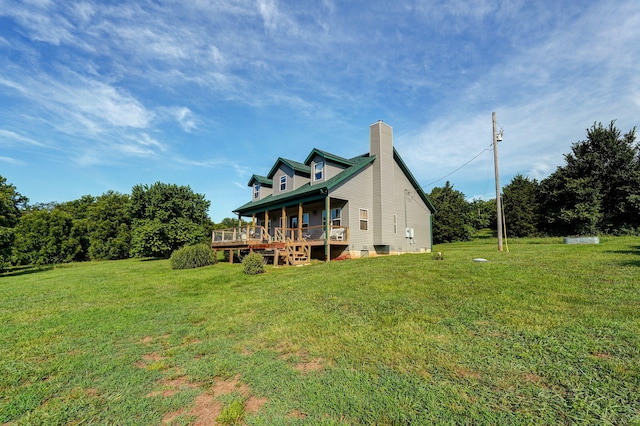 8404 Fossilsaurus Ln, Ash Grove, MO 65604 - rear view of house with a chimney, a yard, and a wooden deck