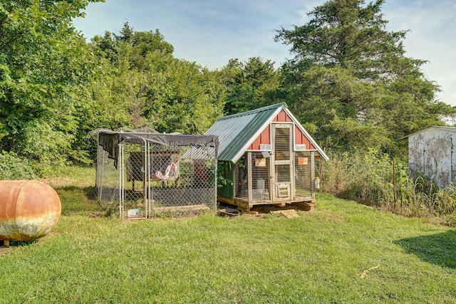 8404 Fossilsaurus Ln, Ash Grove, MO 65604 - view of poultry coop with a yard and a forest view