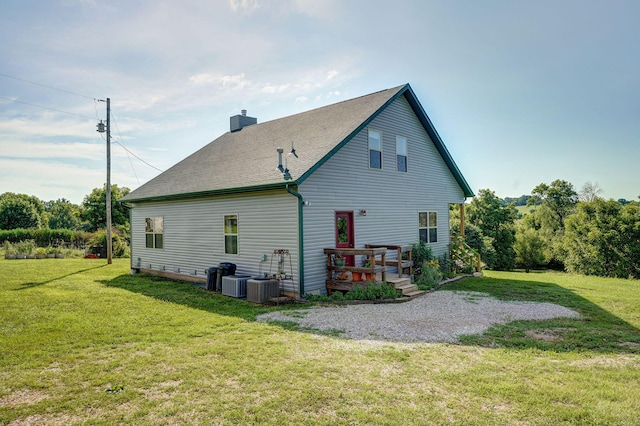 8404 Fossilsaurus Ln, Ash Grove, MO 65604 - back of house with a lawn, a chimney, a deck, and a shingled roof