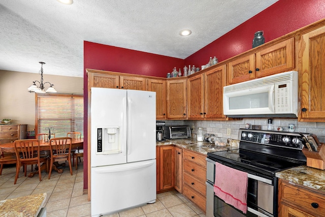 8404 Fossilsaurus Ln, Ash Grove, MO 65604 - kitchen with white appliances, a textured ceiling, a chandelier, brown cabinetry, and tasteful backsplash
