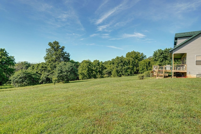8404 Fossilsaurus Ln, Ash Grove, MO 65604 - view of green lawn with a deck