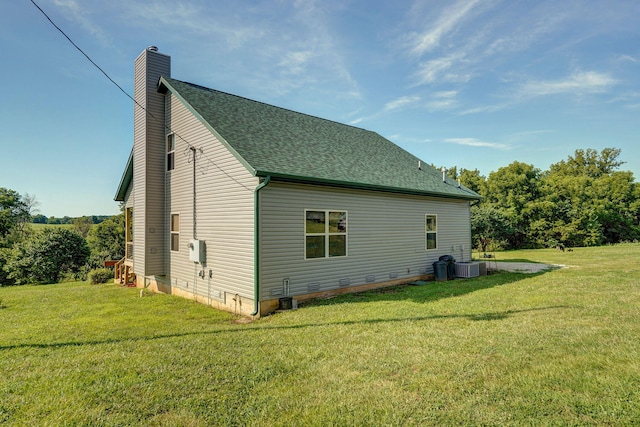 8404 Fossilsaurus Ln, Ash Grove, MO 65604 - view of side of home with a chimney, a yard, crawl space, and roof with shingles