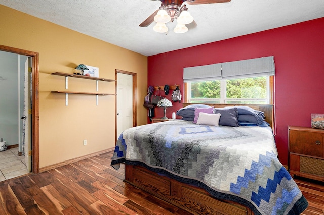 8404 Fossilsaurus Ln, Ash Grove, MO 65604 - bedroom with wood finished floors and a ceiling fan