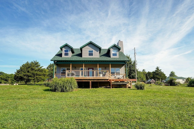 8404 Fossilsaurus Ln, Ash Grove, MO 65604 - rear view of house featuring a chimney, a lawn, a deck, and a shingled roof