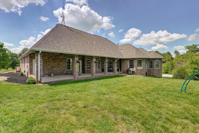 1776 S Gregg Rd, Nixa, MO 65714 - rear view of house featuring brick siding, a patio area, a lawn, and a shingled roof