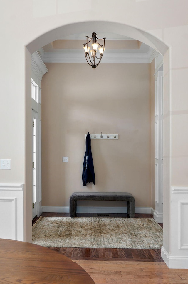 1776 S Gregg Rd, Nixa, MO 65714 - entrance foyer featuring arched walkways, crown molding, a chandelier, and wood finished floors