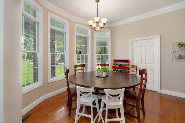 1776 S Gregg Rd, Nixa, MO 65714 - dining space with a chandelier, hardwood / wood-style flooring, and ornamental molding
