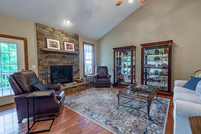 280 Center Rd, Ozark, MO 65721 - living room featuring wood finished floors, a fireplace, ceiling fan, and high vaulted ceiling