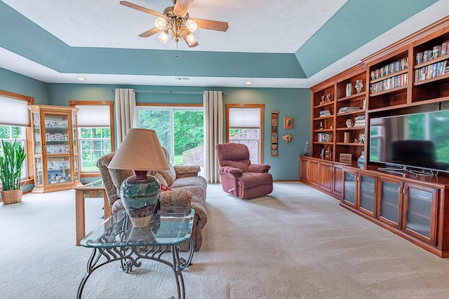280 Center Rd, Ozark, MO 65721 - carpeted living room featuring a raised ceiling, ceiling fan, and recessed lighting