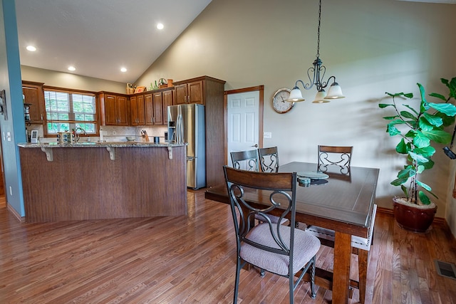 280 Center Rd, Ozark, MO 65721 - dining room featuring a chandelier, wood finished floors, high vaulted ceiling, and recessed lighting