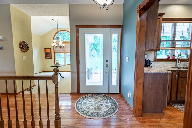 280 Center Rd, Ozark, MO 65721 - entrance foyer with light wood-style flooring, lofted ceiling, and a chandelier