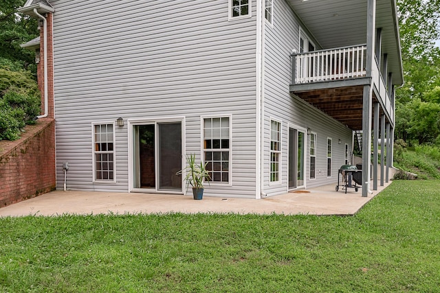 280 Center Rd, Ozark, MO 65721 - back of house featuring a patio, a lawn, and a balcony