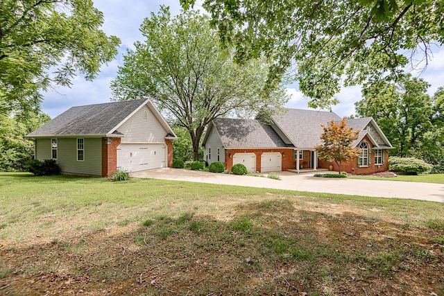 280 Center Rd, Ozark, MO 65721 - view of front of property featuring driveway, a garage, and a front yard