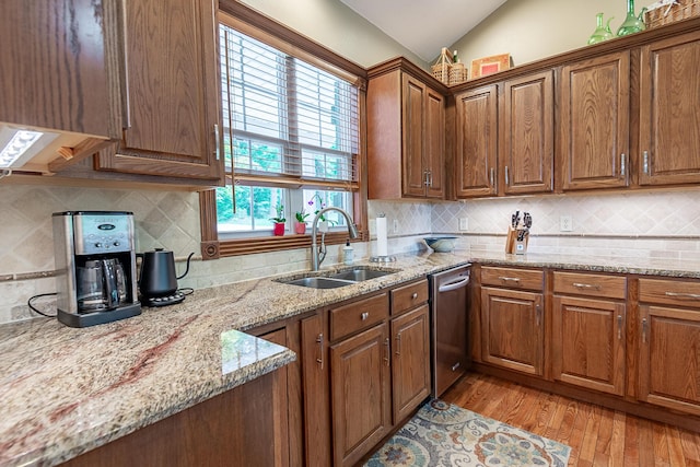 280 Center Rd, Ozark, MO 65721 - kitchen featuring stainless steel dishwasher, vaulted ceiling, light wood-style floors, light stone countertops, and tasteful backsplash