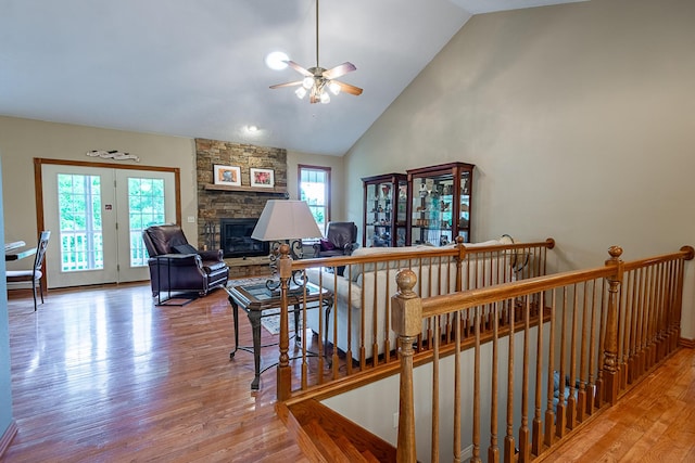 280 Center Rd, Ozark, MO 65721 - stairs with ceiling fan, wood finished floors, a fireplace, and high vaulted ceiling