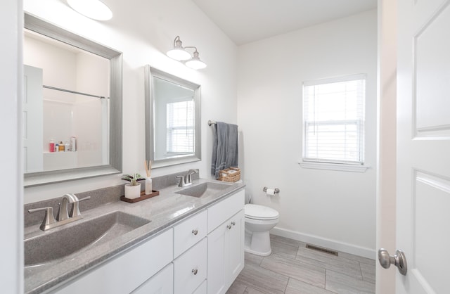 1643 Columbia Ave, Rolla, MO 65401 - bathroom featuring double vanity and a shower
