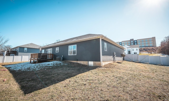 1643 Columbia Ave, Rolla, MO 65401 - rear view of house featuring a fenced backyard and a wooden deck