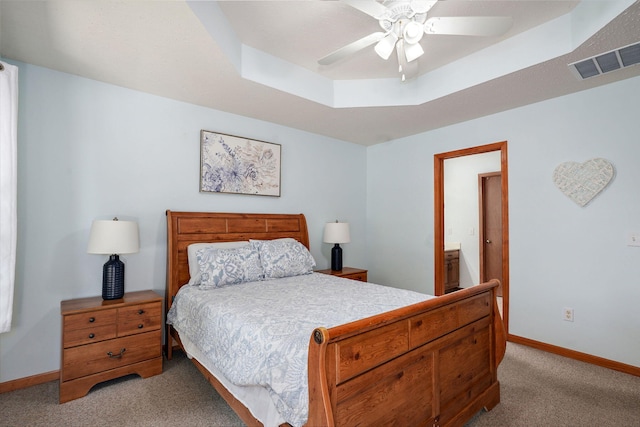3605 N 30th St, Ozark, MO 65721 - bedroom with light carpet, a tray ceiling, a ceiling fan, and ensuite bath