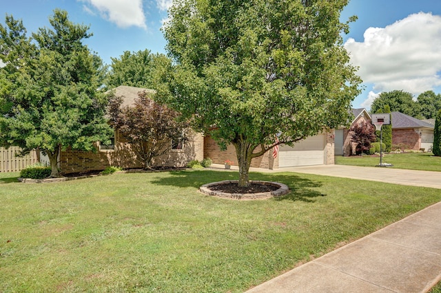 3605 N 30th St, Ozark, MO 65721 - view of property hidden behind natural elements with brick siding, driveway, and a garage