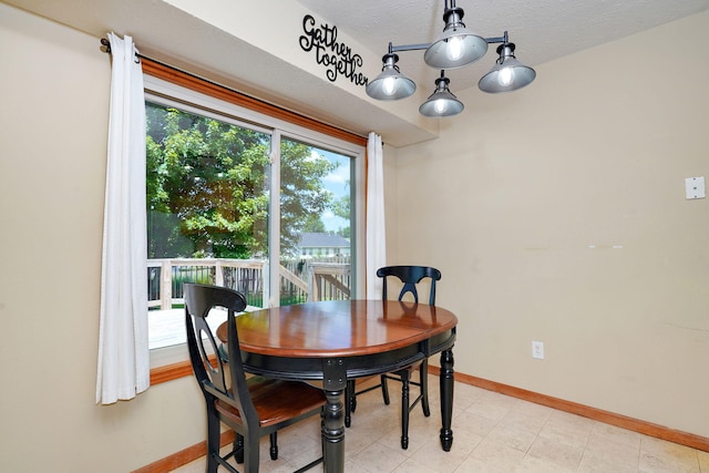 3605 N 30th St, Ozark, MO 65721 - dining space with baseboards and a chandelier