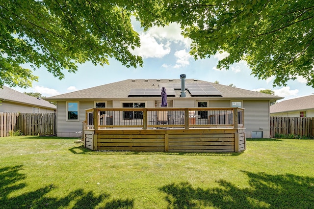 3605 N 30th St, Ozark, MO 65721 - back of property featuring a wooden deck, a fenced backyard, and solar panels