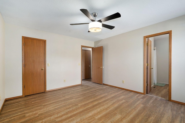 904 N 41st St, Nixa, MO 65714 - unfurnished bedroom featuring light wood-type flooring, ensuite bathroom, and ceiling fan