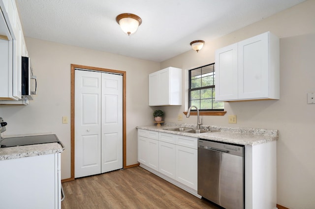 904 N 41st St, Nixa, MO 65714 - kitchen featuring stainless steel appliances, light wood-style floors, light countertops, and white cabinets