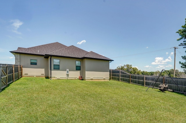 1240 E Keeling Pl, Bolivar, MO 65613 - back of house with a fenced backyard and roof with shingles