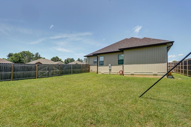 1240 E Keeling Pl, Bolivar, MO 65613 - back of house with a fenced backyard and a shingled roof