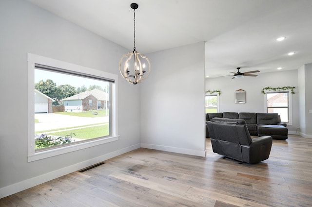 1240 E Keeling Pl, Bolivar, MO 65613 - dining area featuring a chandelier, light wood-type flooring, a ceiling fan, and recessed lighting