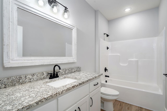1240 E Keeling Pl, Bolivar, MO 65613 - full bathroom featuring vanity, shower / bath combination, wood finished floors, and recessed lighting