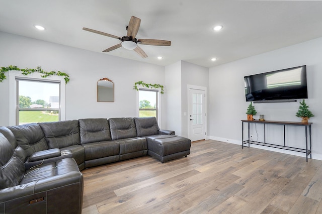 1240 E Keeling Pl, Bolivar, MO 65613 - living room with light wood finished floors, a ceiling fan, and recessed lighting