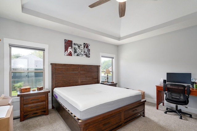 1240 E Keeling Pl, Bolivar, MO 65613 - bedroom featuring light carpet, a ceiling fan, a desk, and a tray ceiling