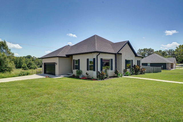 1240 E Keeling Pl, Bolivar, MO 65613 - view of front of home with a garage, driveway, a front yard, and roof with shingles