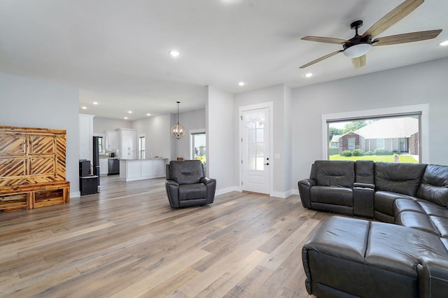 1240 E Keeling Pl, Bolivar, MO 65613 - living area with a ceiling fan, plenty of natural light, light wood-style flooring, and recessed lighting