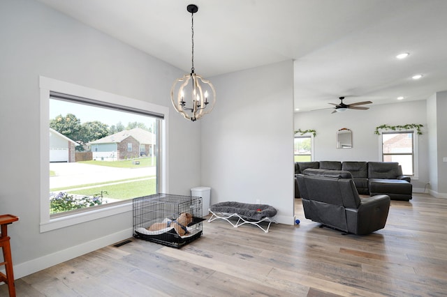 1240 E Keeling Pl, Bolivar, MO 65613 - dining room with a chandelier, wood finished floors, a ceiling fan, and recessed lighting