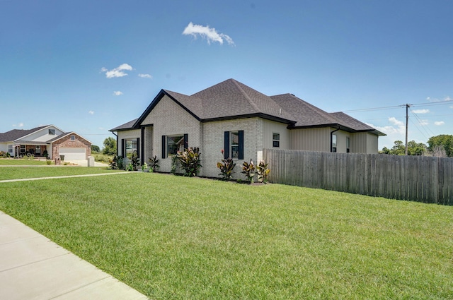 1240 E Keeling Pl, Bolivar, MO 65613 - view of property exterior with brick siding and roof with shingles