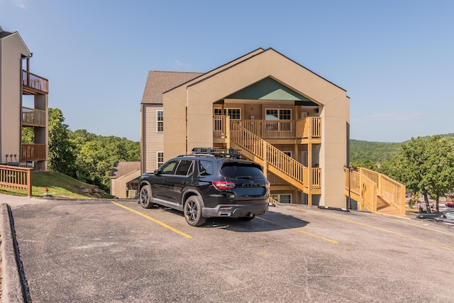 37 Lantern Bay Ln Unit 3, Branson, MO 65616 - view of building exterior featuring uncovered parking and stairway
