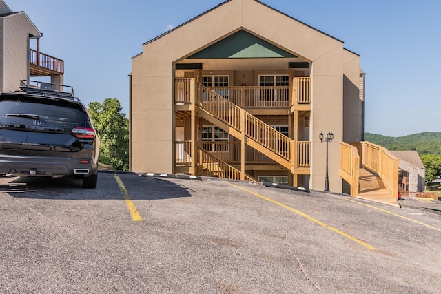 37 Lantern Bay Ln Unit 3, Branson, MO 65616 - view of building exterior featuring stairs and uncovered parking