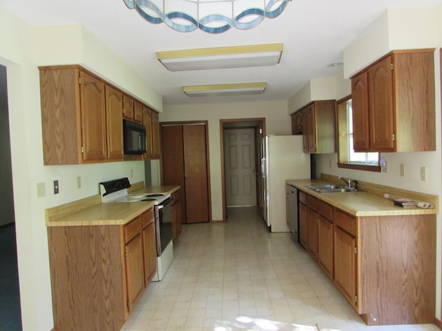 285 Scenic Dr, Forsyth, MO 65653 - kitchen with white appliances, light countertops, and brown cabinets