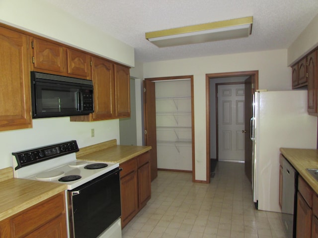 285 Scenic Dr, Forsyth, MO 65653 - kitchen featuring black microwave, electric range, dishwasher, light countertops, and a textured ceiling