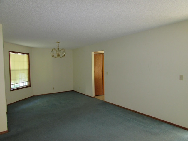 285 Scenic Dr, Forsyth, MO 65653 - unfurnished room featuring a chandelier, carpet flooring, and a textured ceiling