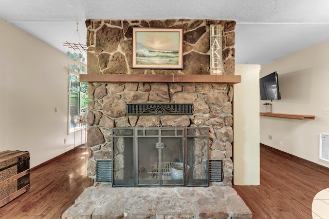 3637 State Highway Y, Forsyth, MO 65653 - detailed view of a fireplace, wood finished floors, and a textured ceiling